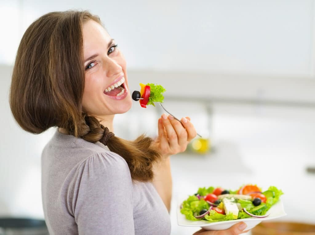 women eating salad