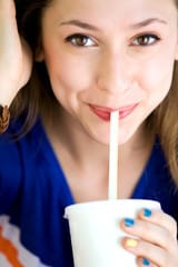 Women drinking from straw