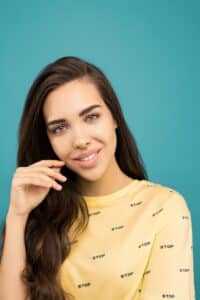 Portrait of beautiful woman in yellow printed shirt