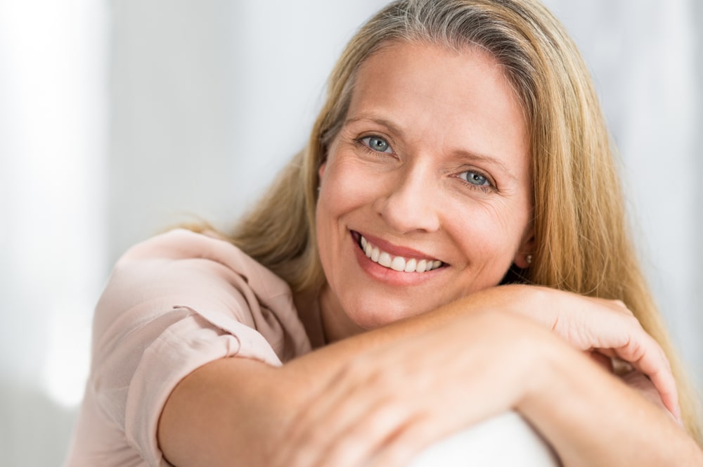 Senior woman has all her teeth thanks to sinus lift bone grafting.